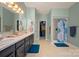 Ensuite bathroom features a double vanity and shower-tub combo at 144 Chickasaw Dr, Shelby, NC 28152