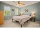 Well lit bedroom features carpeted floor, two windows, and ceiling fan at 144 Chickasaw Dr, Shelby, NC 28152