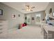 Spacious bedroom featuring neutral carpeting, ceiling fan, large windows, and ample space at 144 Chickasaw Dr, Shelby, NC 28152