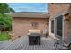 Outdoor deck area with dining furniture and a wood privacy fence with access to backyard and patio at 144 Chickasaw Dr, Shelby, NC 28152