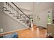 Grand foyer features hardwood floors, a staircase with black and white risers, and a welcoming entrance at 144 Chickasaw Dr, Shelby, NC 28152