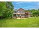 Charming two-story brick home with beautiful landscaping and a covered front porch at 144 Chickasaw Dr, Shelby, NC 28152