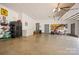 Spacious garage with epoxy floor, garage door opener, storage racks, utility doors and plentiful storage at 144 Chickasaw Dr, Shelby, NC 28152