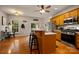 Bright eat-in kitchen featuring stainless steel appliances, wooden cabinets, breakfast nook, and bar seating at 144 Chickasaw Dr, Shelby, NC 28152