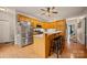 Bright kitchen with stainless steel appliances, wooden cabinets, an island and three bar stools at 144 Chickasaw Dr, Shelby, NC 28152