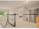 Landing features carpeted floor, natural light, and chandelier at 144 Chickasaw Dr, Shelby, NC 28152