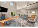 Open-concept living room with a fireplace, high ceilings, and comfortable seating at 144 Chickasaw Dr, Shelby, NC 28152