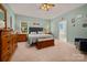 Bright primary bedroom with coordinated furnishings, two windows and ensuite bathroom at 144 Chickasaw Dr, Shelby, NC 28152