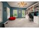 Comfortable home office featuring a built-in desk, shelving, and lots of natural light at 144 Chickasaw Dr, Shelby, NC 28152