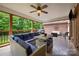 Covered patio with outdoor furniture and ceiling fan, perfect for entertaining guests at 144 Chickasaw Dr, Shelby, NC 28152