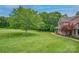 Beautiful brick house on large yard with professional landscaping at 144 Chickasaw Dr, Shelby, NC 28152