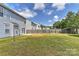 Large backyard featuring a well-kept lawn, a wooden fence, and a patio at 14501 Asheton Creek Dr, Charlotte, NC 28273