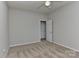 A neutral-toned bedroom features plush carpeting and a ceiling fan for added comfort at 14501 Asheton Creek Dr, Charlotte, NC 28273