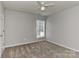 Bedroom featuring carpet flooring, a ceiling fan, and a window for natural light at 14501 Asheton Creek Dr, Charlotte, NC 28273