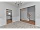 Open dining room with carpet floors, a decorative chandelier, and access to the kitchen at 14501 Asheton Creek Dr, Charlotte, NC 28273