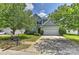 Charming two-story home with a manicured front yard, a two-car garage, and appealing curb appeal at 14501 Asheton Creek Dr, Charlotte, NC 28273