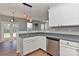Bright kitchen with stainless steel appliances, white cabinets, and an eat-in area overlooking the backyard at 14501 Asheton Creek Dr, Charlotte, NC 28273