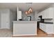 Contemporary kitchen featuring white cabinets, stainless steel appliances and gray countertops at 14501 Asheton Creek Dr, Charlotte, NC 28273