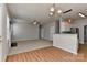 Open living space with a fireplace, a ceiling fan, hardwood floors and access to the kitchen at 14501 Asheton Creek Dr, Charlotte, NC 28273