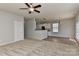 Open-concept layout with kitchen access, carpet, and a ceiling fan at 14501 Asheton Creek Dr, Charlotte, NC 28273