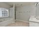 Large main bathroom featuring a bathtub and glass shower along with a double vanity at 14501 Asheton Creek Dr, Charlotte, NC 28273