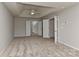 Spacious main bedroom with a tray ceiling leading into the main bathroom and closet at 14501 Asheton Creek Dr, Charlotte, NC 28273
