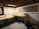 Basement featuring a workbench and unfinished walls, ideal for a workshop or storage space at 1451 Blueberry Ln, Charlotte, NC 28226