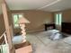 Bedroom with natural light, carpet, and a unique lamp adds character to this space at 1451 Blueberry Ln, Charlotte, NC 28226