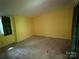 Bright bedroom featuring neutral carpet, and large windows providing natural light at 1451 Blueberry Ln, Charlotte, NC 28226