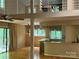 A view of an open-concept living area that connects to a dining area with hardwood floors and neutral paint tones at 1451 Blueberry Ln, Charlotte, NC 28226