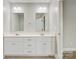 Bathroom featuring a double sink vanity, white cabinetry, tile flooring, and updated lighting at 154 Stable Brook Ln, Taylorsville, NC 28681