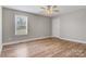 Neutral bedroom with wood floors and a window at 154 Stable Brook Ln, Taylorsville, NC 28681