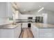 This kitchen boasts white cabinets, granite counters, stainless appliances, and an island, perfect for cooking at 154 Stable Brook Ln, Taylorsville, NC 28681