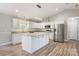 Beautiful kitchen features white cabinets, granite counters, stainless appliances, and large island with ample storage at 154 Stable Brook Ln, Taylorsville, NC 28681