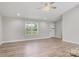 Bright living room features wood floors and neutral paint at 154 Stable Brook Ln, Taylorsville, NC 28681