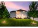 Tranquil backyard with a fire pit and string lights, perfect for evening relaxation and entertaining at 16008 Weeping Valley Dr, Fort Mill, SC 29715
