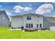 Spacious backyard with a cozy fire pit area and ample seating for outdoor enjoyment at 16008 Weeping Valley Dr, Fort Mill, SC 29715