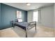 Cozy bedroom showcasing a bed, window, and a wall adorned with artwork at 16008 Weeping Valley Dr, Fort Mill, SC 29715