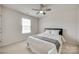 Well-lit bedroom with a ceiling fan and a window providing natural light at 16008 Weeping Valley Dr, Fort Mill, SC 29715