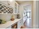 Convenient butler's pantry with wine storage, ample counter space, and a view into the main kitchen area at 16008 Weeping Valley Dr, Fort Mill, SC 29715