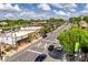 Street-level aerial shot showcases a lively commercial district with diverse storefronts and active traffic at 16008 Weeping Valley Dr, Fort Mill, SC 29715