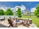 Inviting stone fire pit with Adirondack chairs, perfect for outdoor gatherings and relaxation at 16008 Weeping Valley Dr, Fort Mill, SC 29715