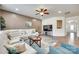 The living room has hardwood floors, a large sofa and a ceiling fan at 16008 Weeping Valley Dr, Fort Mill, SC 29715