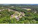 An aerial view of a serene neighborhood, surrounded by lush greenery and mature trees at 161 Leaning Tower Dr, Mooresville, NC 28117
