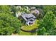 Aerial view of home showing a large deck and beautifully landscaped backyard with retaining wall at 161 Leaning Tower Dr, Mooresville, NC 28117