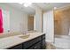 Bathroom featuring a granite-topped vanity, shower-tub combo, and neutral color scheme at 161 Leaning Tower Dr, Mooresville, NC 28117