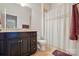 Well-maintained bathroom featuring a tile floor, vanity, and shower with curtain at 161 Leaning Tower Dr, Mooresville, NC 28117