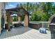 Outdoor deck with gazebo, comfortable seating, and a cozy fire pit area at 161 Leaning Tower Dr, Mooresville, NC 28117
