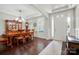Dining room with dark wood floors, a formal dining table, and plenty of natural light at 161 Leaning Tower Dr, Mooresville, NC 28117