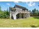 Home exterior featuring a large deck perfect for entertaining and a spacious backyard at 161 Leaning Tower Dr, Mooresville, NC 28117